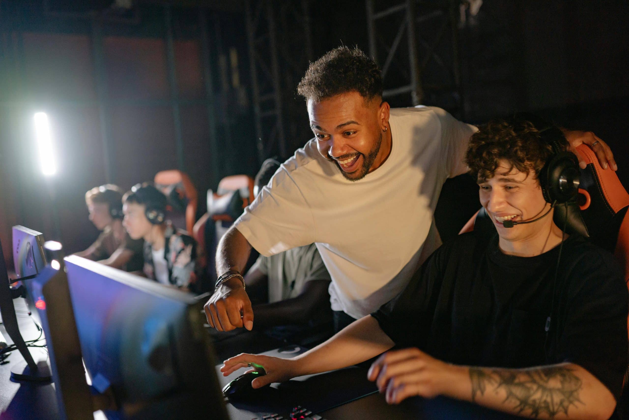 People engaging on a screen with headphones