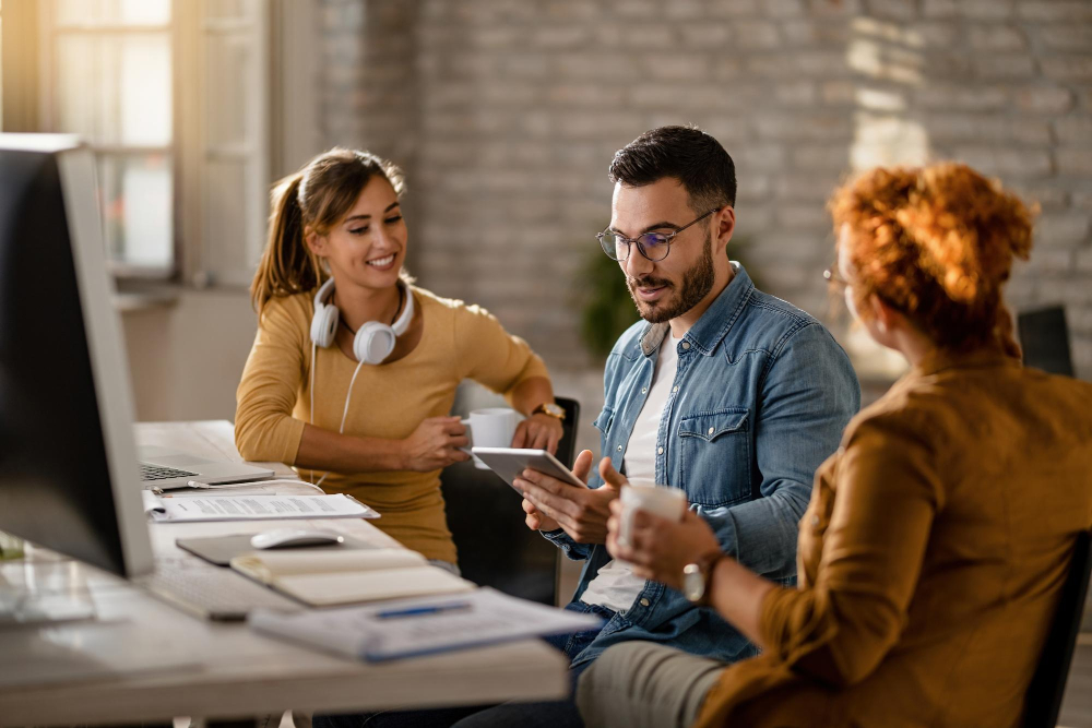 Employer collaborating with learners on a live brief
