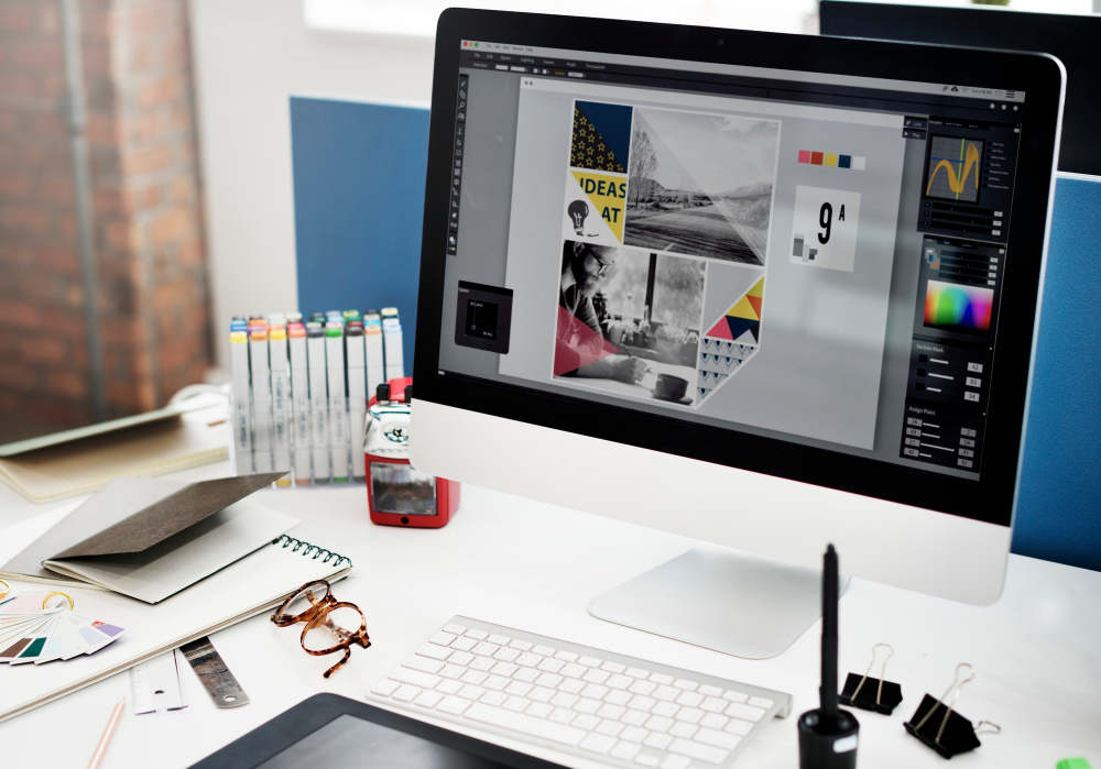 Learner working on visual design at a laptop